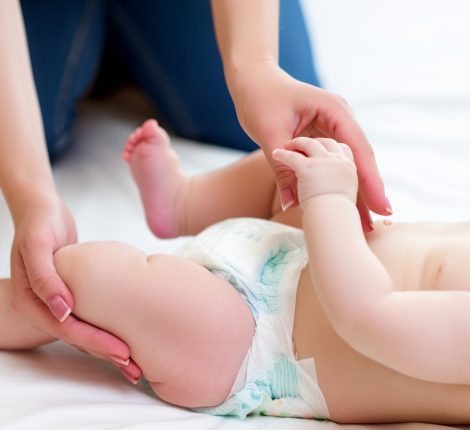 Mother,Making,Her,Child,Wear,A,Diaper